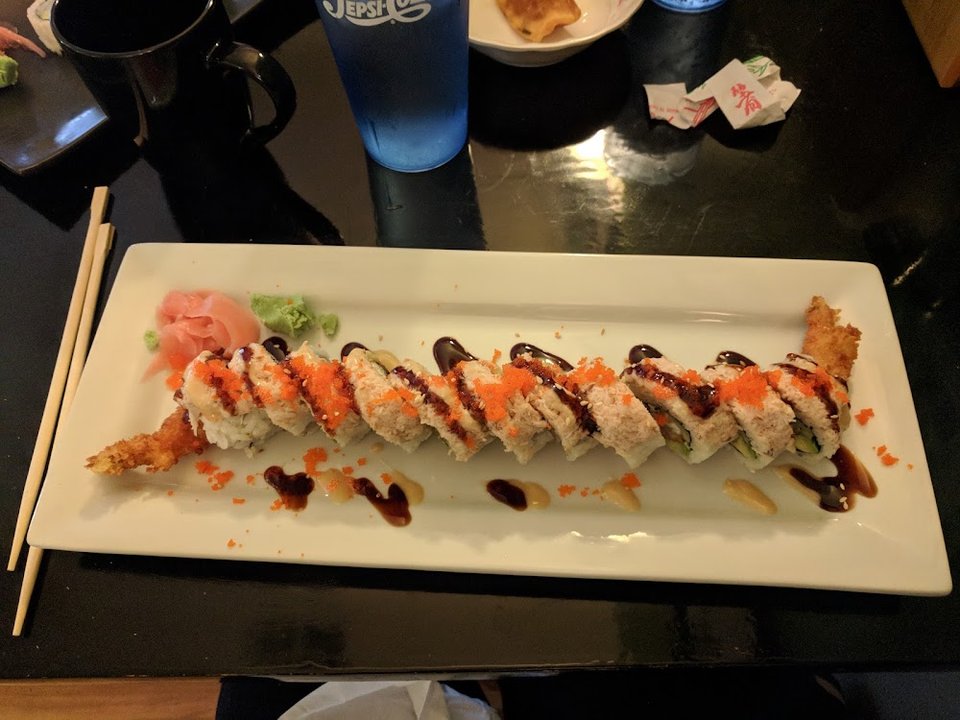 Appetizers and bento box selections on display.