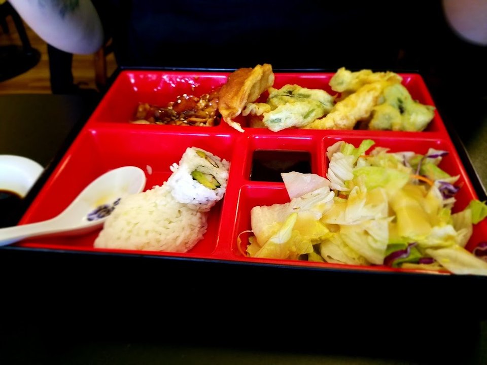 Appetizers and bento box selections on display.